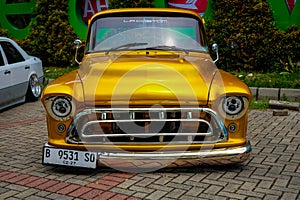 Kustom yellow Chevrolet Apache truck