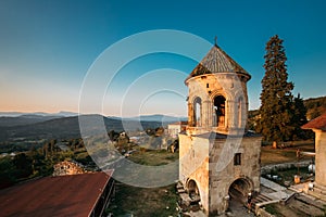 Kutaisi, Georgia. Bell Tower Of Gelati Monastery In Evening Time