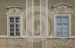 Kutna Hora medieval architecture shows  fanciful window trims with dimensional plaster.