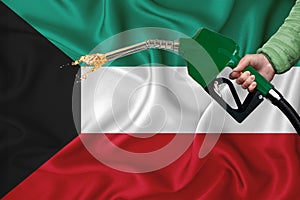 KUWAIT flag Close-up shot on waving background texture with Fuel pump nozzle in hand. The concept of design solutions. 3d