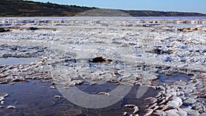 Kuyalnik estuary, Black Sea. Self-precipitating salt at the bottom and bank of the estuary. Table salt crystals