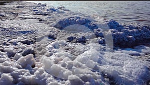 Kuyalnik estuary, Black Sea. Self-precipitating salt at the bottom and bank of the estuary. Table salt crystals