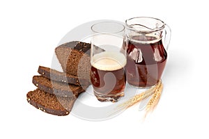 Kvass and bread isolated on white.