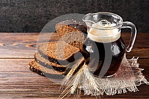 Kvass and rye bread on wooden.