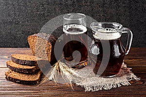 Kvass and rye bread on wooden.