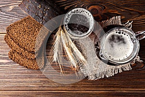 Kvass and rye bread on wooden.