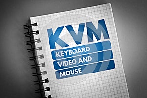 KVM - Keyboard Video and Mouse acronym on notepad, technology concept background photo