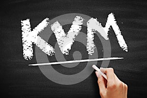 KVM - Keyboard Video and Mouse acronym, technology concept on blackboard photo