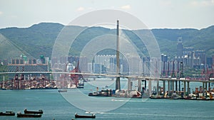 Kwai Tsing container terminal port view and hong kong skyline and stonecutter\'s bridge photo