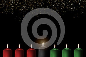 Kwanzaa holiday background with candle light of seven candle sticks in black, green, red symbolising 7 principles