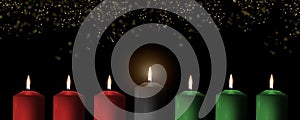 Kwanzaa holiday background with candle light of seven candle sticks in black, green, red symbolising 7 principles of African