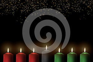 Kwanzaa holiday background with candle light of seven candle sticks in black, green, red symbolising 7 principles of African photo