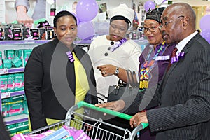 KwaZulu Natal Premier with top women MECs and his first lady buying sanitary pads to help keep poor girls in school