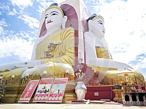Kyaikpun pagoda against blue sky, Four Seated Buddha shrine at Kyaikpun Pagoda in Bago, Burma