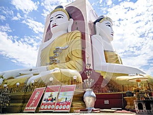 Kyaikpun pagoda against blue sky, Four Seated Buddha shrine at Kyaikpun Pagoda in Bago, Burma