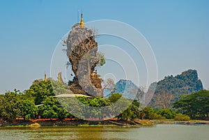 Kyauk Kalat Pagoda. Mawlamyine, Hha-an. Myanmar. Burma. Small pagodas have been erected on a steep rock.