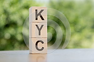 KYC on wooden cubes. Know your customer. Business verifying the identity of its clients concept