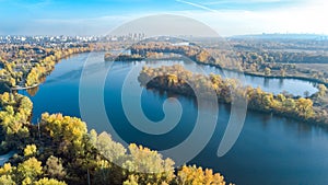 Kyiv city skyline and Dnipro river aerial drone view from above, Kiev Dnieper and Desenka river islands in autumn, Ukraine