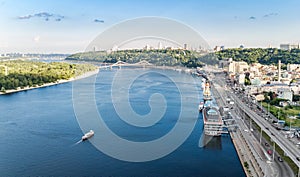 Kyiv cityscape aerial drone view, Dnipro river, downtown and Podol historical district skyline from above, city of Kiev, Ukraine