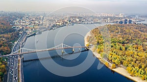 Kyiv skyline aerial drone view, historical Podil district, Dnipro river and bridge cityscape from above, city of Kiev, Ukraine