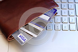 Kyiv, Ukraine - 26 March 2019. Conceptual view of online shopping with credit card,wallet and laptop. Open access for online