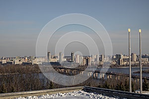 Kyiv, Ukraine. 30.11.2023: view of the left bank of Kyiv and the bridge over the Dnipro River