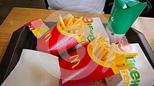 Kyiv, Ukraine - April 16, 2018: Delicious food at McDonald`s. French fries, chicken burger and fried shrimps