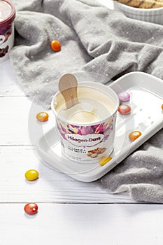 KYIV, UKRAINE - JANUARY 03, 2021: Haagen-Dazs ice cream vanilla macadamia nut bucket.