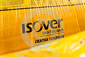 Kyiv ,Ukraine - February 5,2022: Packing pitched roof isover saint-gobain closeup. Insulation material from glass wool and mineral