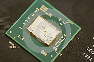 KYIV, UKRAINE - JANUARY 29, 2025 applying thermal paste on a processor for better cooling, computer maintenance, GPU