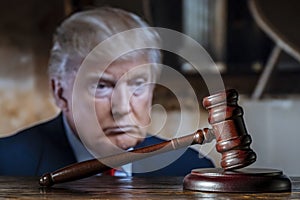 Donald Trump and the court session. The wooden judge gavel on the background of Trump