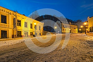 An early morning view of colourful buildings on empty Andriyivskyy Uzvoz Descent or Spusk. One of the oldest street in Kyiv photo