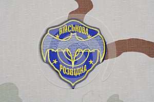 KYIV, UKRAINE - July, 16, 2015. Ukraine's military intelligence uniform badge on camouflaged uniform