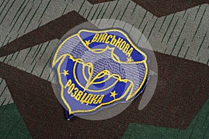 KYIV, UKRAINE - July, 16, 2015. Ukraine's military intelligence uniform badge on camouflaged uniform