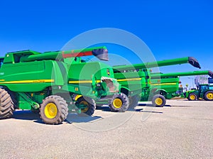 Kyiv, Ukraine - June 16, 2020: Modern John Deere combines at road at Kyiv, Ukraine