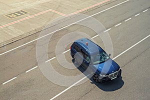 Kyiv, Ukraine - June16th, 2019: Newest big luxury BMW X7 SUV car as safety car with blinkers light bar on asphlat tarmac