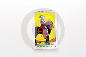 Kyiv, Ukraine - May 22, 2022 : Tarot cards, Rider Waite tarot cards,the knight of pentacles card in the foreground.