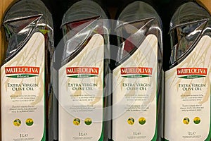 Kyiv, Ukraine 28.07.2023: - Mueloliva olive oil in glass bottles in shelf in supermarket for sale