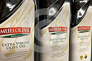 Kyiv, Ukraine 28.07.2023: - Mueloliva olive oil in glass bottles in shelf in supermarket for sale