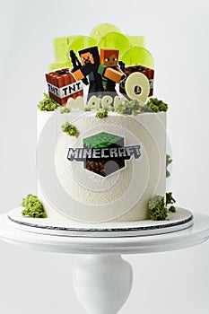 Birthday cake for a Minecraft video game fanboy decorated with transparent caramel candies, edible