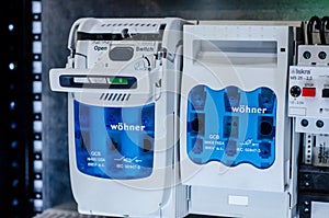 Kyiv, Ukraine - October 20, 2021: Installing WÃÂ¶hner fuse switch disconnector in distribution board