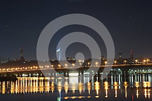 KYIV, UKRAINE - SEPTEMBER 03, 2022. Beautiful view of Kiev, the capital of Ukraine. Night view across the Dnieper River. The