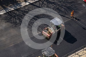 KYIV, UKRAINE - September 10, 2020: Heavy asphalt road roller with heavy vibration roller compactor that press new hot