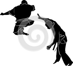 Kyokushinkai Karate. Silhouette of a karateka doing standing side kick photo