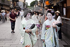 KYOTO,JAPAN- CIRCA MAY, 2016: Maiko geisha walking on a street of Gion in Kyoto Japan