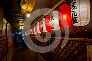 KYOTO, JAPAN - JULY 05, 2017: Beautiful paper lamps at night insdide of a building in Gion DIstrict, Kyoto