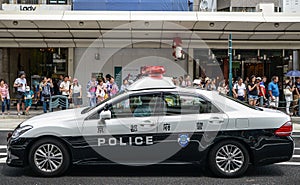 Kyoto, Japan - 24 July 2016. Police car at the Gion Matsuri festival at hot summer day in Kyoto.