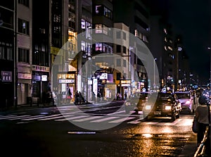 Kyoto view at night, street with cars and colorful neon lights