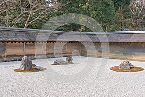 The Kare-sansui dry landscape zen garden at Ryoan-ji Temple in Kyoto, Japan. It is part of Historic
