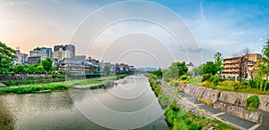 KYOTO, JAPAN - MAY 31, 2016: Kamo river and Kyoto skyline at sunset